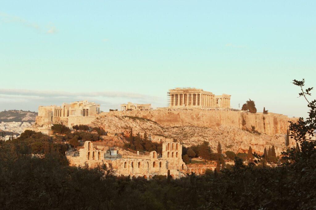 pexels photo 6924327 6924327 The iconic Acropolis of Athens, a UNESCO World Heritage Site, bathed in warm sunset light.